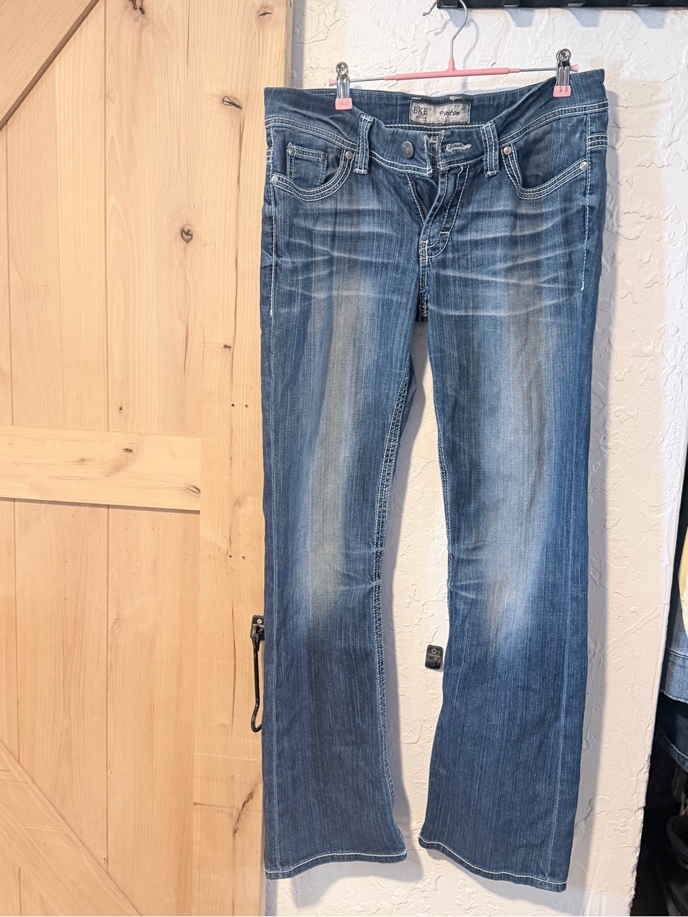 BKE Women's Medium Blue boot cut jeans - has a tear. Please see photos